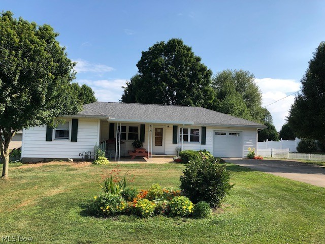 Enjoy a peaceful country setting, nearly 1/2 acre lot  close to town. 3 bedrooms, 1 1/2 baths. The 4th bedroom was converted to a first floor laundry, could easily be turned into a bedroom again. Beautiful hardwood floors thru out. Large living room and dining area, very useable kitchen space with appliances. Clean dry basement and attached garage. Many updates include newer garage door, roof shingles, egress window in the basement. Move-in ready. Great starter home or size down retreat.