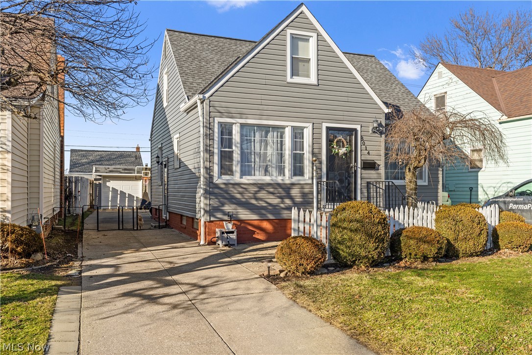 Welcome to this well-maintained Cape Cod offering 4 bedrooms, 2 full baths, a finished lower level, and a 2-car garage. This move-in ready home features great curb appeal with a classic white picket fence, updated siding and gutters (2024), and front steps replaced in 2021. Inside, you’ll find an updated kitchen (2018), new first-floor flooring (2024), and a functional layout with plenty of living space. The second floor includes two bedrooms, hardwood flooring, a loft-style hallway, and a spacious walk-in closet. The finished lower level adds a large rec room, bonus room ideal for an office or playroom, workshop area, laundry, and full bath setup, with new flooring completed in 2022. Additional updates include the roof (2016), hot water tank (2018), insulation (2020), and a backyard gazebo added in 2022. Convenient Parma Circle location close to highways, shopping, and more. All Appliances stay!! Except additional 2 refrigerators and 1 freezer located in the basement
