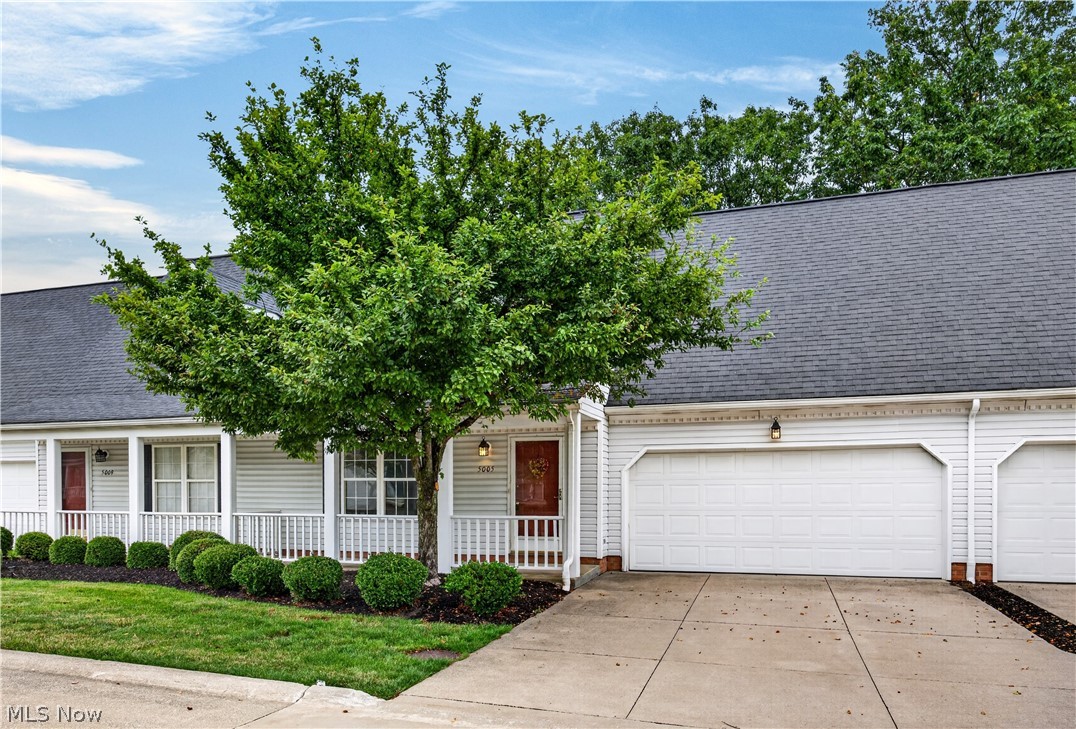 Welcome home! Enjoy your morning coffee on the charming front porch of this warm and cozy condominium, and then settle in and appreciate its 4 bedrooms and 3 full bathrooms. From the moment you walk in you’ll feel right at home as brand-new carpet flows throughout the main floor and the spacious and functional kitchen features a double sink and breakfast bar. The family room is the heart of the home, featuring a stunning stone wall with a gas fireplace and a natural wood mantle - the perfect place to unwind at the end of the day. Glass doors open to a concrete patio -  a lovely outdoor space to relax and recharge. First-floor living is made easy with a main floor bedroom and full bathroom, a practical touch that works beautifully for anyone seeking single-level convenience. Upstairs you’ll find generously-sized bedrooms, including a guest suite with two single closets and an attached full bathroom. Two additional bedrooms share a well-appointed full hall bathroom. A two car garage rounds out everything this home has to offer. This one checks all the boxes - pop in and see it for yourself!