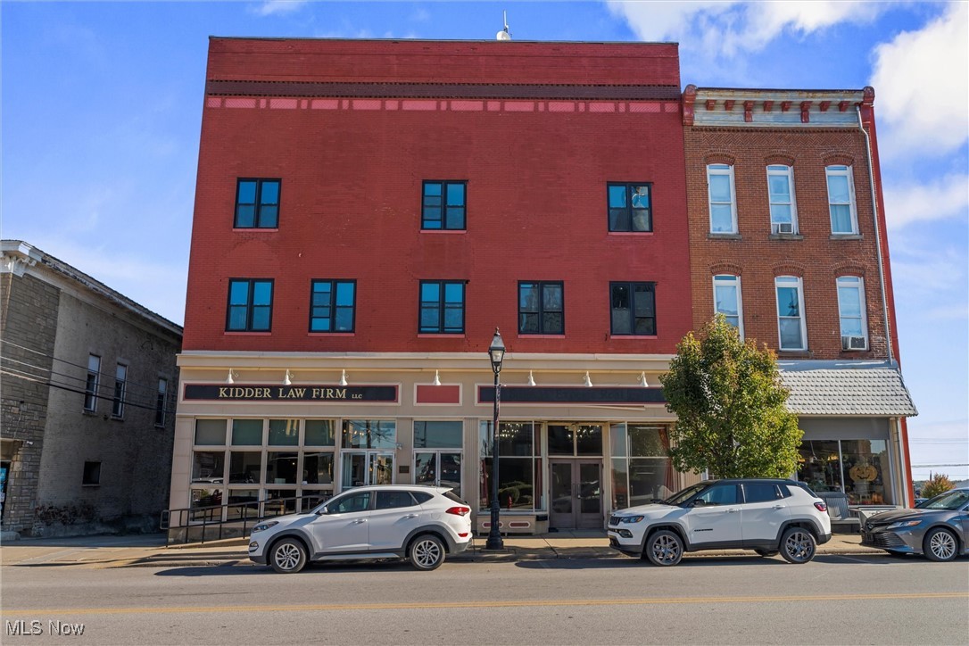 Prime Mixed-Use Investment Opportunity in Downtown Cadiz. Ideally located across from the Harrison County Courthouse in the quaint village of Cadiz, this three-story brick commercial building combines timeless character with modern potential. Rich in history and overflowing with charm, this former opera house maintains many of the stunning original features & design of the late 19th century. Moses Fleetwood “Fleet” Walker, the first African American Major League Baseball player in 1884 (pre Jackie Robinson and league reform) ran the opera house/movie theater for 18 years after his retirement. The property features two fully renovated street-level professional storefronts - perfect for retail, office, or service-based businesses—one unit is currently leased, offering immediate income. The second and third floors include eight apartment units that have been completely gutted, with significant progress made on electrical and plumbing updates. With newer windows already installed, these units are ready for your finishing touches—ideal for conversion into short- or long-term rentals. Situated on a high-visibility corner lot, the property includes rear parking, ample green space, and close proximity to local dining, shopping, and community amenities. Nestled in a rapidly growing region at the heart of Ohio’s Oil & Gas country, this property presents outstanding potential for investors and entrepreneurs alike.