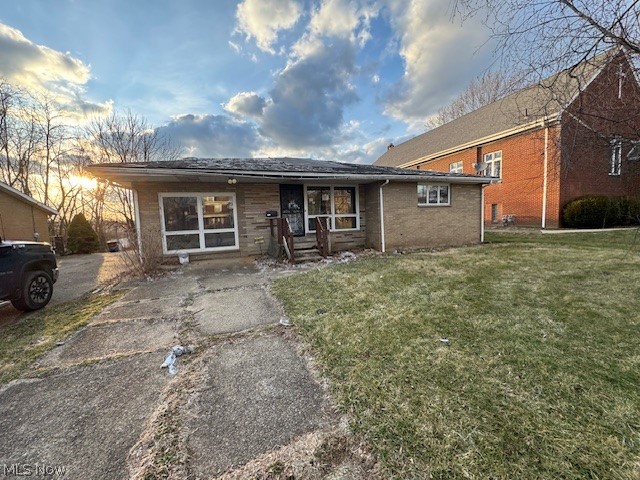 This spacious brick ranch offers over 1,800 square feet of living space with a distinctive design and plenty of character. The home features 3 bedrooms, 2 full baths, two living areas, an oversized basement, an enclosed porch, and a 2-car attached garage with a paved driveway. The backyard includes an additional detached 2-car garage topped by a 672-square-foot apartment, providing excellent potential