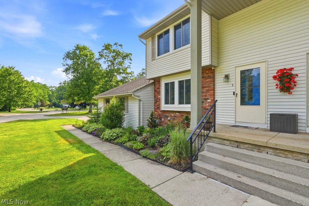 Welcome to your opportunity to enjoy low-maintenance living in the highly desirable Aurora Shores community! This well-maintained 3-bedroom, 1.5-bath townhouse-style condo offers a spacious and functional layout with room to spread out. Step inside to a welcoming living room featuring a cozy fireplace, creating the perfect space to relax or gather with family and friends. The living room flows seamlessly into the dining area, where sliding glass doors lead to a private, fenced patio, an ideal setting for morning coffee, outdoor dining, or simply unwinding after a long day. Just off the dining space, the kitchen offers an abundance of cabinet and counter space, making meal preparation and storage a breeze.  Upstairs, you'll find all three bedrooms, including a generously sized primary bedroom complete with walk-in closet space. A full bathroom serves the upper level, while a convenient half bath is located on the main floor. The partially finished basement provides valuable additional living space and endless flexibility for a recreation room, home office, or workout area, along with additional storage and laundry space. Completing the package is a 1-car garage and all the benefits of living in the Aurora Shores. Enjoy access to the community's 300+ acre lake offering boating, fishing, swimming, skiing, tubing, and more. Residents can also enjoy mulitple pools, beaches, playgrounds, and volleyball, tennis, pickleball, and basketball courts. Don't miss your chance to own this fantastic home and enjoy the incredible lifestyle Aurora Shores has to offer!