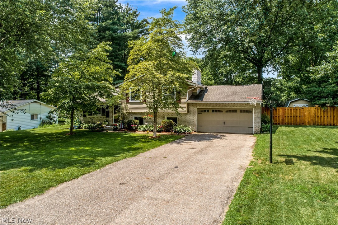 This is a beautiful must see 3 bedroom 1 and a half bath split level house that is located in Lawrence Township in the Northwest school district. With plenty of updates which includes a new deck over looking a newer fenced in back yard. Along with a firepit in the rear yard for those chilly fall nights, you will love the outdoor living space this house will provide. The kitchen has new flooring, countertops, paint, and newer stainless steel appliances which will remain with the home if desired, it also provides a eating bar and eat in kitchen which is opened up to a sprawling living room. There is an additional family room just steps away with a gas fireplace and carpet that was just installed! Rooms are good sized with fresh paint, and a powder room inside the master. From the  private back yard  and spacious rooms and features, this house will move fast!