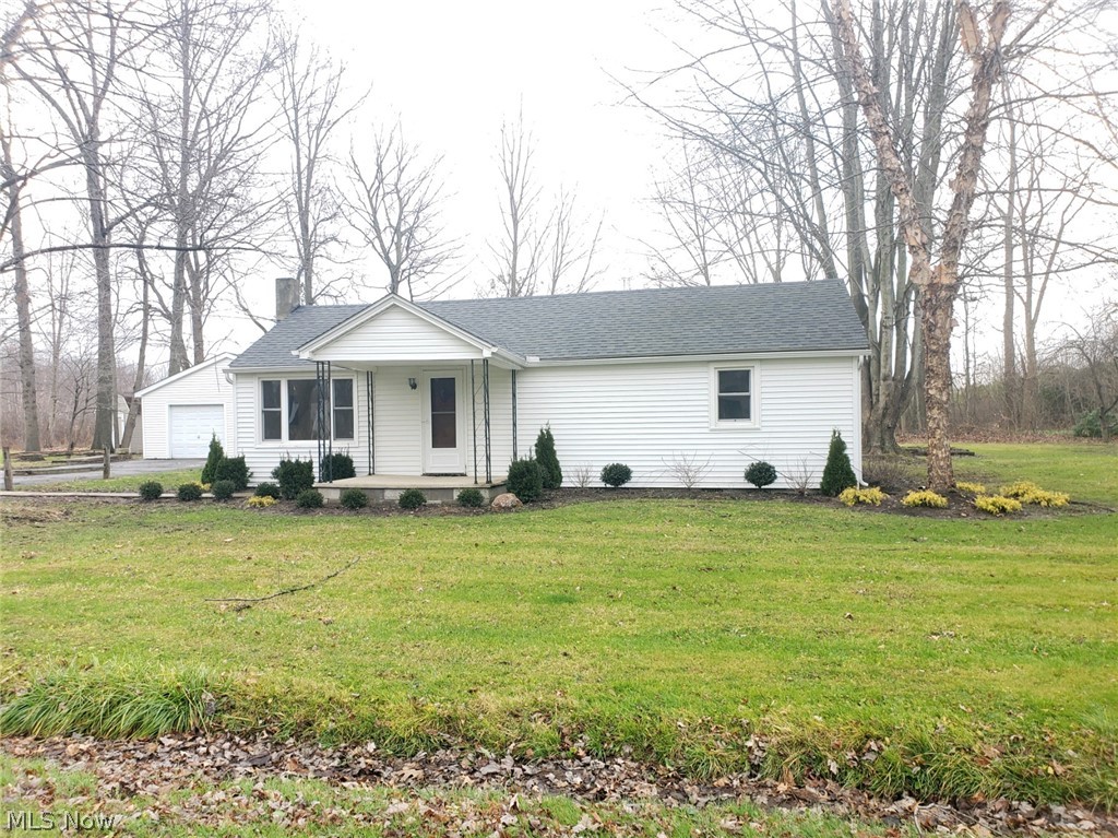 Located on a quiet dead end street is this well maintained 2 bedroom 1 bathroom ranch. If you enjoy being outdoors this home could be just right! Boasting not one but two garages that are 24x24, for the homeowner that needs all the space for cars, atv's. Or a plow for the paved driveway! Also an easy to maintain landscaping with fresh bushes planted this past fall. This yard ready to go for the next mowing season! Newer siding and roof as of 2017.  As you enter the home you will find a bright living room filled with natural light. The flow of this home moves effortlessly from the living room to the two bedrooms that have good sized closets, all the way back through to the open kitchen and dining room that has new laminate floors just installed!  Should you come through the side door, you will enter into the large laundry and mud room. A great space to take off your shoes, and notice how warm your feet are! That's right! The laundry room AND bathroom have heated floors. Great home to st