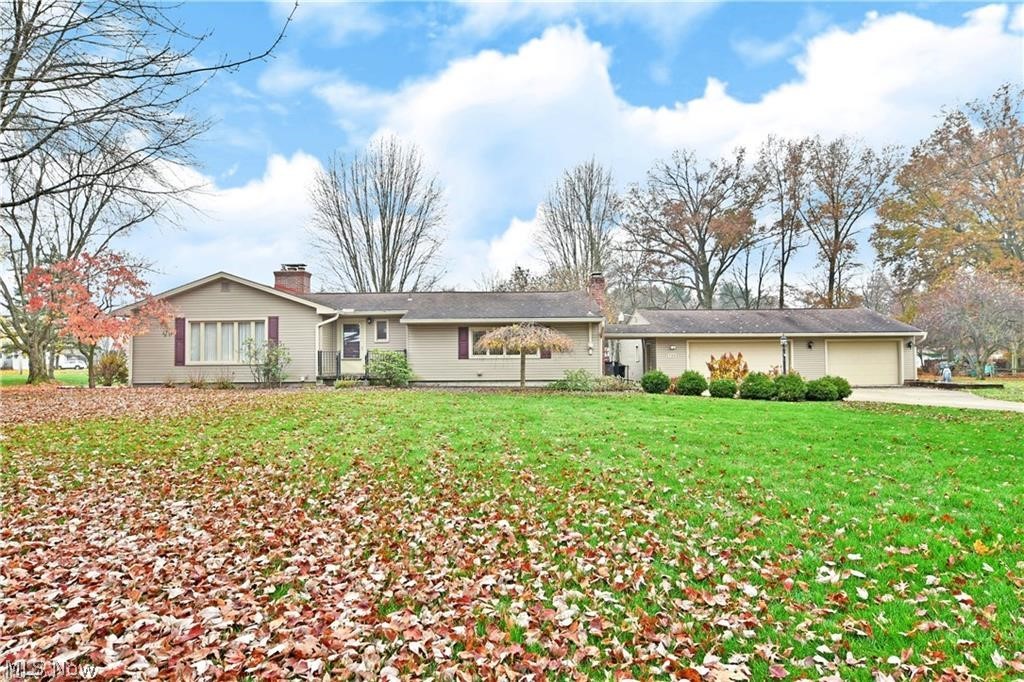 Sprawling ranch home offering 1,888 square feet of comfortable living space on over 1.3 acres in desirable Boardman! The main level features an updated eat-in kitchen with granite countertops, a dining area that opens to the inviting living room with fireplace, and a step-down family room with a second fireplace—perfect for entertaining or relaxing. Three generously sized bedrooms, an updated full bath, and a convenient half bath complete the main floor. The huge full basement provides abundant storage space and includes a dedicated laundry area. Outside, enjoy the oversized four-car garage, a bright three-seasons sunroom, large rear deck, and additional storage shed. With plenty of indoor and outdoor space, this property offers the perfect combination of comfort, function, and privacy.