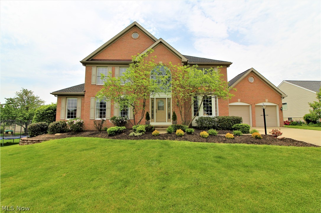 Visit the 3D tour of this home on the link above!!!  Come visit this magnificent center hall colonial in the very popular Hyde Park neighborhood and you will know this is your next home!  The grand two story foyer with matching leaded glass headers into the formal living room is just one example of the expert craftmanship in this beauty!  This year, the seller put in a new kitchen and new master bathroom! Wood floors were put in almost the entire first floor! The stunning updated kitchen features all nice KitchenAid appliances and a breakfast bar with stools with plenty of granite and upgraded cabinetry.  In addition to the open layout of the kitchen to the family room (with gas fireplace), you will be pleased with not only a wine bar in the dinette area, but also a large 30x16 deck immediately off the dinette area that will fit plenty of friends and family for the numerous gatherings you will want to have at this home! We finish the first floor with French doors to a first floor offic