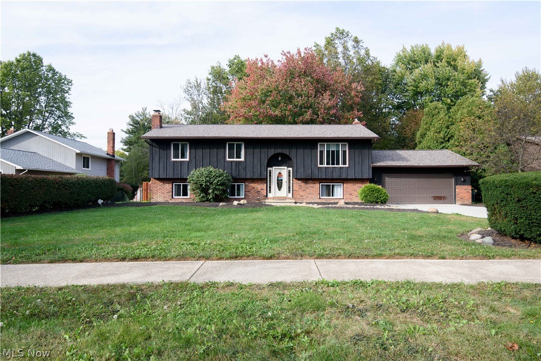 Fully updated 3 Bed/2 Full Bath 2172 sqft. Bi-Level. The new concrete driveway leads to an attached 2 car garage. Brand new roof in 2021. The .41 acre lot has a wooded back yard and is fully fenced in with a new concrete patio and a sliding glass doors leading to lower level. The walk-out lower level has been fully updated in 2019 with laminate flooring throughout and equipped with a wood burning brick fireplace.  The upper level is also newly updated in 2018 with beautiful white cabinets granite counters laminate flooring stainless steel appliances and a door off the kitchen that leads to a new wooden deck and staircase to the backyard/lower patio. Minutes away from Krueger Park and Creekside shopping center. Move in ready! A MUST see!