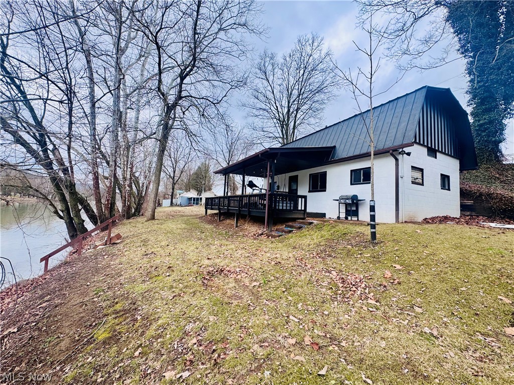 Are you ready to spend your summer on the river?! Enjoy peaceful riverfront living with direct frontage on the Muskingum River, complete with your own boat dock for easy water access. Relax on the covered porch overlooking the river, the perfect spot to take in scenic views and unwind year-round.

Inside, the home features an open kitchen and living area with tall ceilings and a cozy fireplace, creating a bright and inviting atmosphere. A pellet stove adds warmth, charm, and energy efficiency. The loft-style layout offers two bedrooms, providing a unique and functional design.

Outside, the scenic yard offers plenty of space to enjoy nature, along with an additional storage building for tools, gear, or recreational equipment. This riverfront retreat blends comfort, character, and outdoor living in a truly special setting.