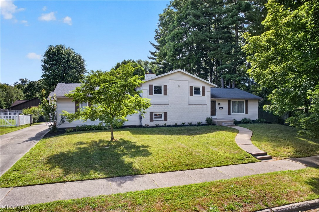 Welcome Home! This spacious 4-bedroom, 2-bathroom split-level home offers the perfect combination of comfort, functionality, and an unbeatable location close to parks, schools, and shopping.

The bright country kitchen features custom oak cabinetry and trim, Corian countertops, ceramic tile flooring. Enjoy gathering in the formal living room or relax in the cozy family room for room to spread out. 

The spacious primary bedroom includes a room-sized walk-in closet, which could easily be turned back into a bedroom. Also on this floor another bedroom and full bathroom. In the lower level along with the family room is a full size bath and 4th bedroom.  
Across from the laundry is another great size room for a home office or bedroom. 

Car enthusiasts, hobbyists, and anyone needing extra storage will love the incredible garage space! In addition to the oversized attached 2-car garage, you'll find a 28' x 32' detached 3-car garage with 10-foot doors—offering garage space for up to five vehicles.

Step outside to enjoy the private backyard with a patio, perfect for entertaining, relaxing, or outdoor activities.

This home offers space, updates, and an exceptional amount of garage storage that's hard to find. Schedule your private showing today!