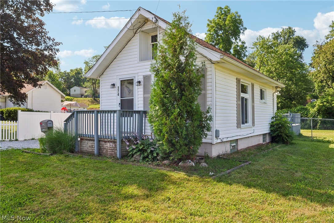 Don't let the size fool you—this adorable and beautifully updated tiny home offers everything you need with the added bonus of a rare double lot! Full of charm and character, this move-in ready home is perfect for first-time buyers, those looking to downsize, or anyone seeking an affordable home with plenty of outdoor space.

Step inside to find a fully applianced kitchen that flows into the dining room and cozy living room, creating a functional and inviting layout. The bright and cheerful sunroom adds valuable living space and features sliding glass doors leading to a spacious deck, making it the perfect place to enjoy your morning coffee or entertain family and friends.

The fully fenced backyard provides plenty of room for pets, gardening, outdoor games, or simply relaxing. A detached 2-car garage, gravel driveway, and walk-up attic offer excellent storage and future possibilities.

The full basement includes a shower, sump pump, and glass block windows for added peace of mind. A window air conditioning unit is included for seasonal comfort.

Recent improvements make this home truly move-in ready and include updated electrical, new flooring, fresh interior paint, an updated bathroom, roof (2017), and a new hot water tank (2026).

Whether you're looking for a cozy place to call home, a low-maintenance lifestyle, or an investment opportunity, this charming property combines affordability, updates, and outdoor space that's hard to find at this price. Schedule your private showing today!