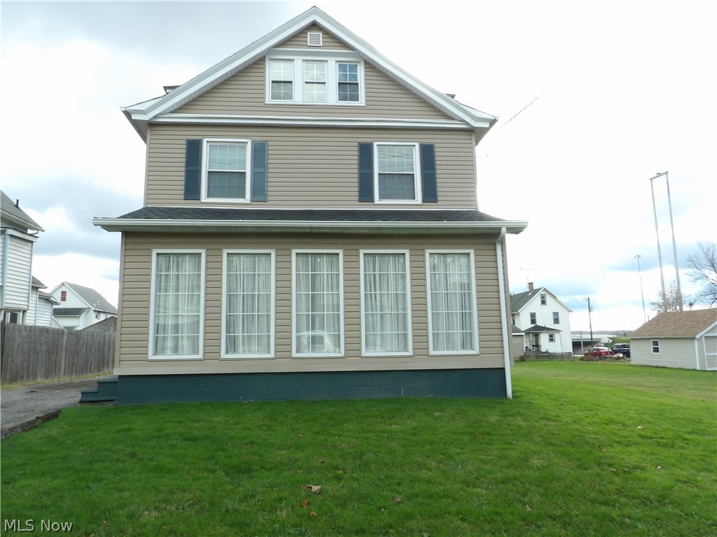 Charming 4 bedroom with 1.5 baths, Girard City Schools, Close to the freeway home.  On the first floor an adorable eat in kitchen, a large dining room, with doors leading out to deck, a large living room with additional living space provided from the finished screened in porch.  On the second floor you'll find 3 bedrooms, a large bath and a laundry room.  The third floor has a bedroom and an extra room that with a little tlc could be a fifth bedroom or additional living space.