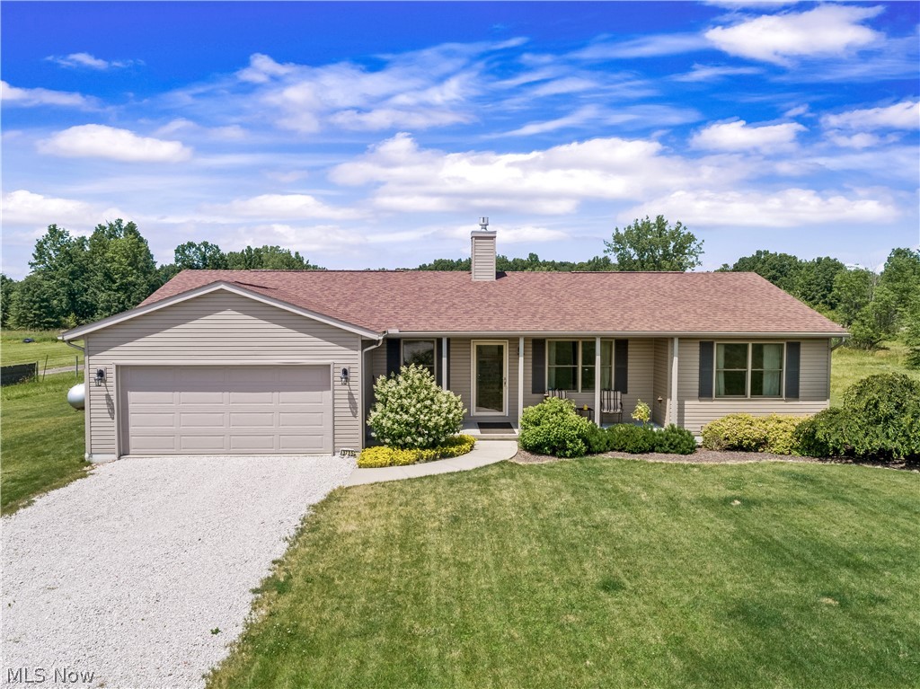 This 2014 built split bedroom ranch sits on 5 beautiful acres in Guilford Twp with wooded views overlooking the partially fenced backyard! A covered front porch ushers you into the front door to a great room with a gorgeous stone fireplace and vaulted & beamed ceilings. An open floor plan throughout the great room, dining area & kitchen make this home easy to entertain in! The kitchen offers lots of cabinetry with pull-out drawers, stainless appliances and a center island with breakfast bar! The laundry room is conveniently located on the first floor & has a large storage closet and access to the 2 car attached garage. The master bedroom has a walk in closet & private bath with a tiled shower! Two additional bedrooms & a guest bath are located at the opposite end of the home. A spacious sunroom has a cozy feel with vaulted, wood-clad ceiling, walls of windows & a sliding door leading to the concrete patio.The full basement is ready to be finished for additional living space! Don't miss