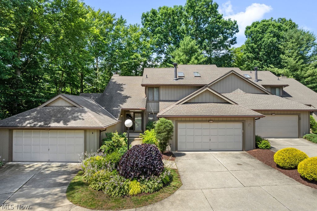 LOOK NO FURTHER! Welcome to this contemporary-style 2-story home located in The Crossings of Cuyahoga Falls, offering a spacious, airy floor plan designed with comfort and style in mind. Vaulted ceilings, an abundance of windows, and natural light throughout bring the beauty of the outdoors inside, creating a warm and inviting atmosphere. This incredible community is just steps away from the breathtaking Cuyahoga Valley National Park, offering endless opportunities for biking, hiking, walking trails, picnic areas, and outdoor adventures. Enjoy the convenience of being minutes from the vibrant Downtown Cuyahoga Falls area, featuring restaurants, boutiques, shopping, the amphitheater, kayaking, and seasonal ice skating. Easy access to Akron and Cleveland makes this location unbeatable! Inside, you will fall in love with the dramatic 2-story great room featuring soaring ceilings and beautiful views. The formal dining room is perfect for entertaining, and the extensive kitchen offers upgraded cabinetry, granite countertops, a bar-height counter, upgraded appliances, and a spacious eating area surrounded by windows. Step through the sliding door onto the deck and enjoy peaceful views of the trees and creek from your own private retreat. This home features TWO owner's suites, one conveniently located on the first floor and another on the second floor. Both offer walk-in closets. The second-floor owner's suite includes a luxurious bath with a jetted tub, molded solid-surface double sinks, and beautiful hardwood flooring. The second level features an oversized loft overlooking the foyer and great room, providing the perfect space for a home office, media room, or additional living area. Enjoy resort-style living with the community's heated pool. The perfect place to relax and unwind during those warm summer days. This home truly offers the perfect blend of nature, luxury, and convenience. Experience all that The Crossings has to offer. Vacation living in your own backyard!
