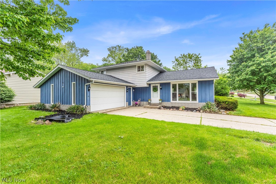 Welcome to this charming 4-bedroom, 1.5 bath home in Brunswick, designed and built by Ken Cleveland Builders in 1971. The 3 bedrooms on the upper level have the original hardwood floors, the 4th has LVT and is on the lower level. Everything has been freshly painted and there is brand-new LVT throughout the main and lower levels, with new cabinetry and a new wooden countertop in the kitchen. Check out the vaulted and beamed ceiling in the spacious living and dining room and the family room in the lower level, which features a cozy wood-burning brick fireplace with a raised hearth. Step into the backyard through the sliding glass door onto the screened-in back patio, perfect for relaxing, while you enjoy the privacy of a fully enclosed, gated, vinyl fence.  Best of all, in the summer, you'll have convenient access to the community swimming pool (almost literally) across the street, along with a playground and basketball area - all included in your annual HOA fee. It's the perfect blend of comfort and convenience. Eagle Oaks is a great, safe neighborhood with excellent schools, and a family-friendly community, representing what is best about Brunswick! Schedule your showing today and find out for yourself!!