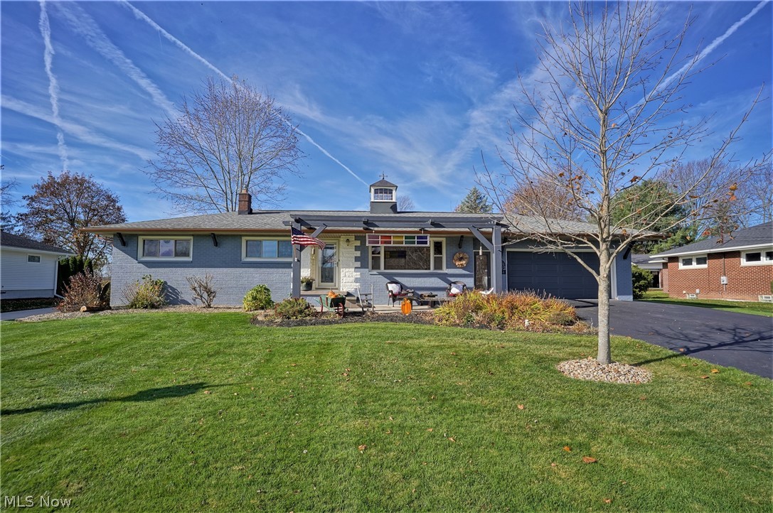 This amazing Schumacher built home has been updated and is a blend of farmhouse, industrial & contemporary style!  You really must see it to believe the details, quality and special features that it has to offer.  The spacious living room has hardwood floors, wood beams and a gorgeous barn door, which leads you into the eat in kitchen/dining area.  The kitchen features Kraftmaid cabinets with custom California cedar doors with metal accents, pull outs, under cabinet lighting, tin ceiling and high end appliances (new microwave is on order).  The finished lower level offers 3 finished spaces perfect for a recreation room (with bar) and the options are endless - exercise room, craft room, office - whatever fits your needs.  The outside is a dream with it's concrete patio, swing, and tremendous cedar outbuilding, which offers black metal roof, vaulted cedar beams, many windows allowing for an abundance of natural light, wood burning fireplace, stamped concrete floor,  and electricity.  You