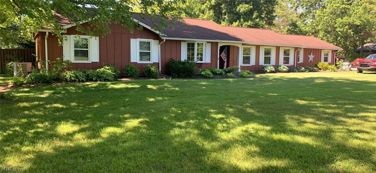 Well maintained sprawling 3 bedroom, 2.5 bath ranch sits on 5 beautiful acres! Inside you will find a large living room, family room with wood burning stove and sliding doors to a private patio. The master suite has a walk-in shower, large closet, and access to the patio. The enclosed porch overlooks luscious landscape, trees, and backyard. There is also a creek in the back before the woods. Plenty of parking space with 2-car garage and pole barn. Call to schedule a private tour!!