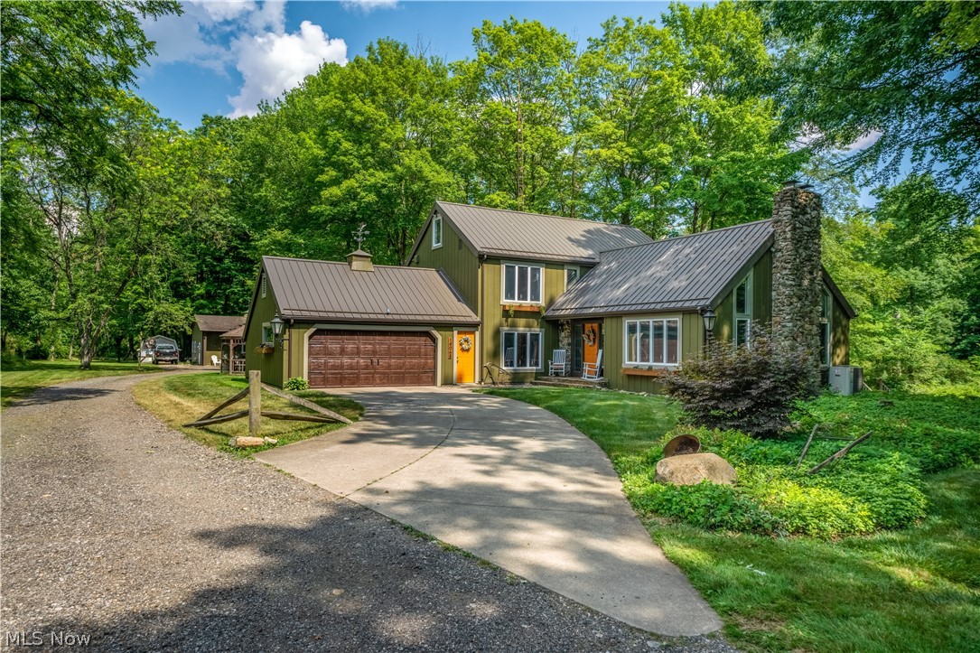 This stunning home overlooks 7 acres of beautiful woods.  This amazing one of a kind home offers 3/4 bedrooms and 3 full baths.  Gorgeous updated kitchen with quart countertops & stainless steel appliances.  This amazing property overlooks the peaceful Deer Creek!  The abundance of windows allows year round views of this serene setting.  2 authentic stone fireplaces.  The back building offers every owners dream - perfect for overnight guests, private home office or outstanding man cave.  This home has been updated from top to bottom & is move in ready!