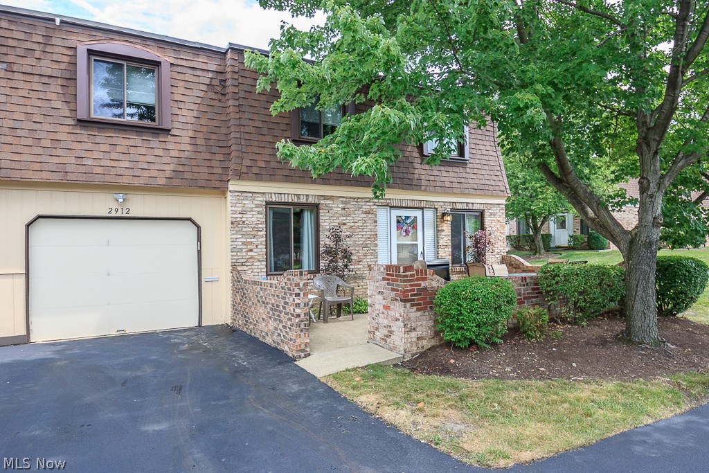 So much home wrapped up in this end unit 3 bedroom condo! You will want to buy this and so will everyone else! The private masonry patio offers outdoor seating and is surrounded by green space and trees and is unique in this complex. Many updates have been made in this home such as a newly remodeled open kitchen including neutral cabinets, counter tops and ceramic tiled backsplash. The dining room space can fit many guests while you entertain. The family room is large enough to fit a sectional couch and is brightly lit by a large picture window. In winters you will love that your car is kept in the garage and protected by the elements of snow. Upstairs offers the master bedroom with an oversized closet for clothing and storage. This room is large enough to fit a king sized bed and furniture. The other two rooms provide deep closets and extra storage for seasonal items too. You never need to bring your clothes downstairs again when your laundry room is located on the upper floor! This h