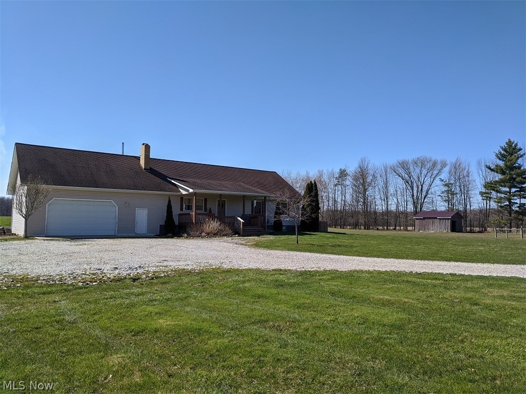 This stunning 3 bedroom, 2 bath custom Ranch located on 21.33 acres is the outdoor lovers paradise. The open concept living area with a stone fireplace makes entertaining a breeze. The home has oak trim throughout, vaulted ceiling and oak hardwood floors throughout the main level. Spacious kitchen with huge island offering plenty of storage and stainless appliances. First floor master suite with large soaker/jetted tub and walk-in closet. Tax records have home listed as a 2 bedroom but the 200 sq ft loft offers the third bedroom space. Finished walk-out lower lever with a stone fireplace. The room in the basement could be a fourth bedroom. The attached 2.5 car garage has a woodburner and offers an alternative heating source. Recent improvements include furnace in 2017, central air 2018, fenced in back yard, Samsung washer and dryer 2017, Samsung refrigerator 2017 and dishwasher 2017. The new french door with doggie door lead to the covered back deck. Other features include a 4-5 acre s