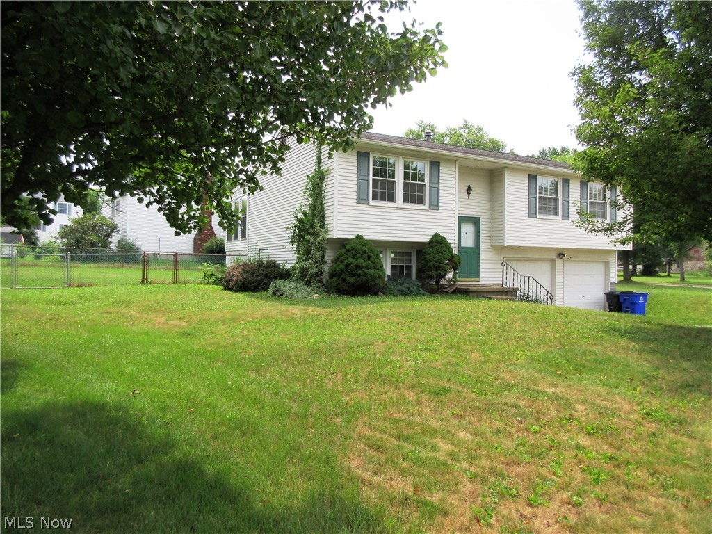 Come and see this nice bi-level home on a quiet cul-de-sac street in Kent. This home has a huge fenced in back yard, on a corner lot. When you step into the foyer, you can go up to the open floor plan with large living room, which flows into the dining room and kitchen, or down to the attached deep garage, and a huge recreation room in the lower level. The recreation room has track lighting, a nice half bath, good storage closets, and laundry area. This home has 3 bedrooms and a full bath with newer shower. (2020). An outstanding feature is the fully enclosed sunroom with heat off the dining room, so it's perfect for entertaining! The sunroom has windows that give the room so much natural light, and a sliding door with newer stairs that leads to a newer patio. The kitchen appliances stay with the home. The furnace and AC are new! ( 2022) You have two separate big living areas in the home, so there is space for everyone! You can enjoy all that downtown Kent has to offer, close proximity