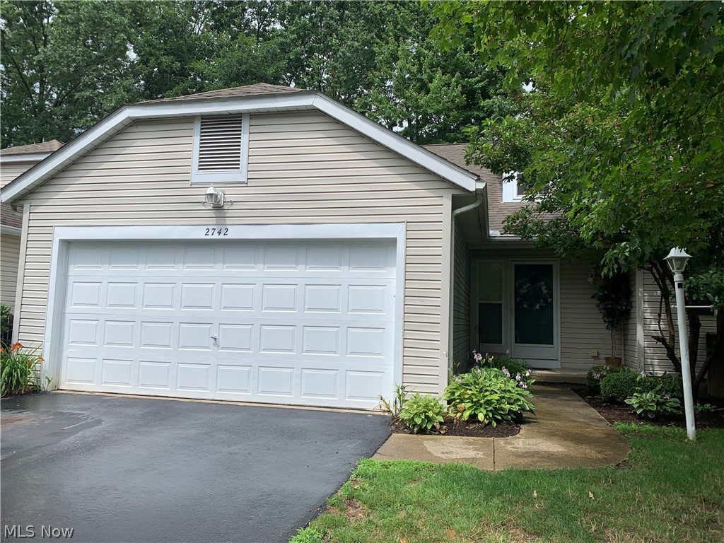 Woodbury Condo! Nestled in the heart of Stow this 2 Bedroom, 2.5 bath is move in ready.  As you enter, you will love the open spacious floor plan. The great room with vaulted ceilings walks out to the private patio with newer landscaping.  The kitchen offers newer stainless steel appliances and a breakfast bar.  There's room for your dining furniture as well.  The first floor master bedroom, features a walk in closet and well appointed master bath. The convenient first floor laundry, with washer and dryer, is just steps away.  Upstairs you will find the loft that overlooks the great room, the second bedroom and another full bath. There is a large walk in storage area, as well.  The lower level offers a spacious family room and office area, too.  Lots of storage.  Updates include range 2019, dishwasher 2020, Refrigerator 2013, disposal 2015, washer/dryer 2016, furnace and central air 2013. The attached garage has additional storage, water and a heater. Showings start Friday July 16.
