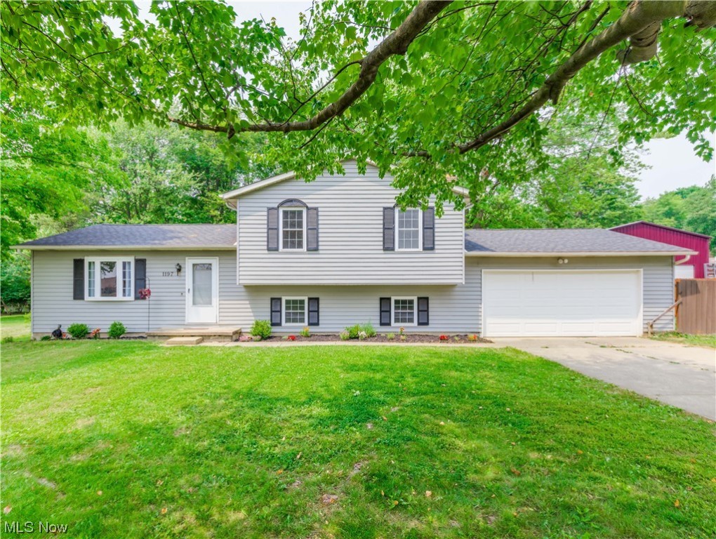 This Brimfield beauty just might be the one you've been waiting for. This attractive 4 level split is conveniently situated near I-76, shopping and is within the Field local  School District. Step into the formal living room that is open to the dining area and leads to the kitchen. This area is light, bright and open. Beautiful kitchen with light colored cabinets, subway tile backsplash, granite counters and stainless appliances.  Sliders to the deck overlooking the private backyard. Up a few stairs to three bedrooms and a beautiful bathroom. Down a few steps to a family room with fireplace and an area that was converted to create  an office and 4th bedroom but designed  to easily be converted back to one room. Then there's a basement with a full bath and rec room or work out room. Updates include a complete tear off roof in 2019, central air in 2019,exterior painted in '19, a repurposed shed in '16, new gutters in '16, updated electric panel, newer well pressure tank and water softner