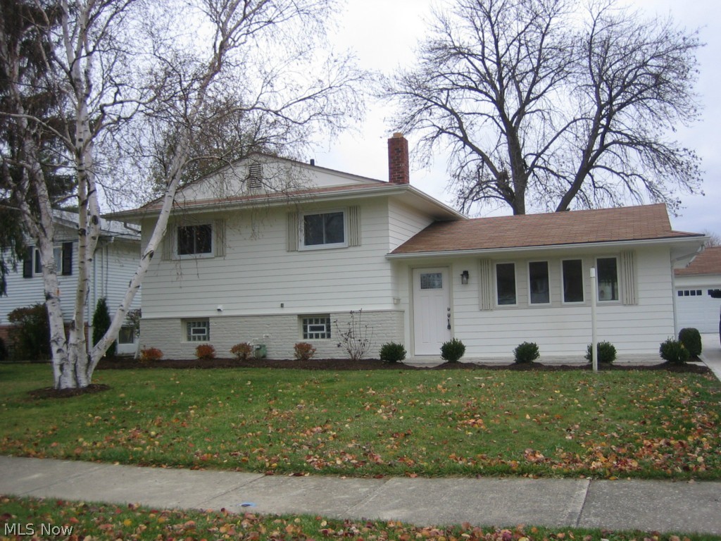 This completely updated split level has 3 bedrooms and finished basement. Move right in, with an updated kitchen (mahogany cabinetry) SS dishwasher and microwave, wood floor throughout kitchen and dining room. New bathroom including tub, vanity, faucets and floor. New entry doors, lighting and ceiling fans, Anderson crank out windows, new hot water tank, updated electrical. Freshly painted inside and out. Paver bricks on rear patio with new 2 car garage door even a brand new freshly poured driveway!! Won’t last act quickly!