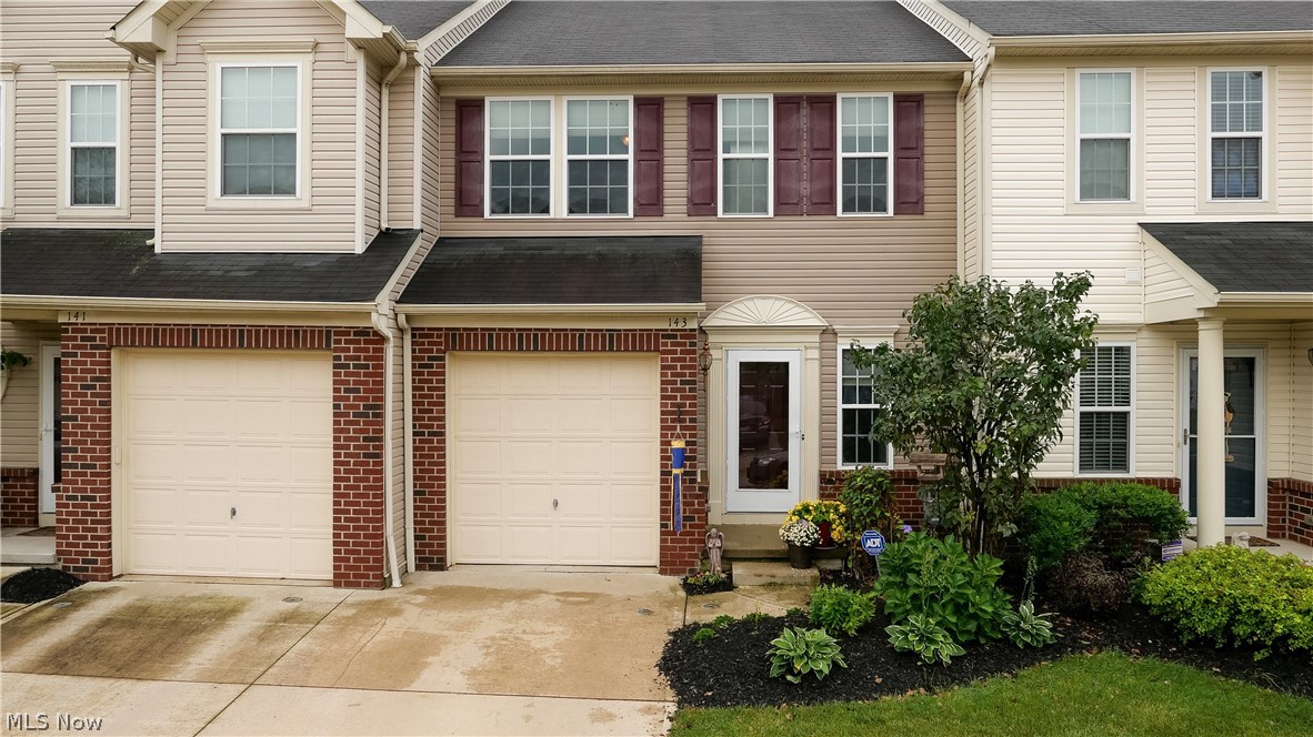You will be delighted when you enter this meticulously maintained and updated 3 bedroom 2 ½ bath Sandstone Ridge Townhome. New laminate floors greet you at the foyer and carry throughout the living Room, dining room, kitchen, and half bath. The kitchen features new tile backslash and all appliances stay. The Half bath, access to the private rear patio area off the dining room, and access to the 1 car attached garage complete the first floor. Upstairs you will find a spacious master suite with a private full bath and walk in closet. Two additional bedrooms, the 2nd full bath, and the laundry room complete the 2nd Floor. Washer and dryer stay. Ceiling fans in all 3 bedrooms and the dining room. The lower level has a finished rec room and includes 3 closets and a separate storage area. Fresh paint throughout. All window treatments stay. 1 year home warranty included. Schedule your private showing today before it's gone, these townhomes go fast.