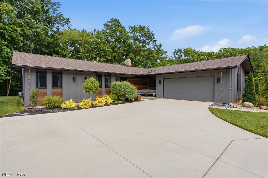 Nestled on one of Strongsville's most picturesque cul-de-sacs, this stunning ranch has been transformed with impeccable craftsmanship, timeless design, and luxury finishes at every turn. Designed for both entertaining and everyday living, the open floor plan features a dramatic wall of 6 foot tall windows, neutral wall colors, and is move in ready.  The 2024 gourmet kitchen has custom cabinetry, open shelving, solid surface countertops, a 7-foot island, Samsung Bespoke induction range and refrigerator, a coffee station, beverage refrigerator, and more! A charming wood-burning fireplace creates a warm focal point within the kitchen, while the adjoining living/dining area boasts views of the private wooded backyard. The luxurious primary suite offers a private 9 x 12 deck access, a custom walk-in closet, a spa-inspired bath, plus an extra bonus space with an all-in-one washer/dryer, pull-out ironing board, and drying rack.  Two additional remodeled bedrooms, a flexible office space near the front of the home, a renovated full guest bath, and a redesigned laundry/mudroom complete the main level. The finished lower level offers a spacious recreation room, new full bath, 2025 kitchenette, oversized windows, abundant storage with two immaculate crawl spaces, and a flex room ideal as a fourth bedroom, fitness room, hobby space, or workshop. The private backyard extends the home's exceptional design with an elegant brick patio, professional landscaping, and a wooded setting. Additional improvements include a brand new roof (2026), driveway (2024), doors & windows-2024 (excluding the living room, basement, and garage), a new laundry LG Wash Tower (2025), updated lighting, and countless custom improvements. (See full list of updates at the house, or on the MLS.) Why wait to build when you can move right into a home where every luxury upgrade has already been completed?  Come and see this incredible home and fall in love!