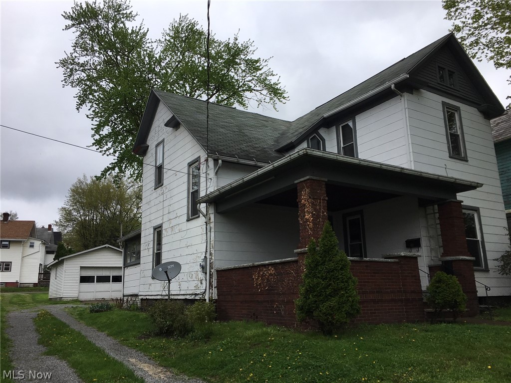 Great opportunity in Wooster!  This home is nearly 2000 square foot, with 3-4 bedrooms and 2 full bathrooms.  The huge front porch is a great space for entertaining and enjoying a nice day. Enter into the foyer, where you will immediately notice the tall ceilings and so many beautiful and original features of the home.  The bright, formal living room features the original fireplace and mantel (not working).  Opening up into the large den/family room, with ceiling fan.  Then to the formal dining room and kitchen, both with ceiling fans.  The kitchen has laminate floors and a range and refrigerator, that stay.  Off of the kitchen is the enclosed back porch and other side, an exterior door, basement access and a full bath.  The bathroom has a walk-in shower and laundry area with washer and dryer that stay.  Up the charming stairway to the second floor.  Be sure to notice the unique window in the hallway.  The master bedroom is connected to a bonus room.  This could be a nursery, 4th bedro