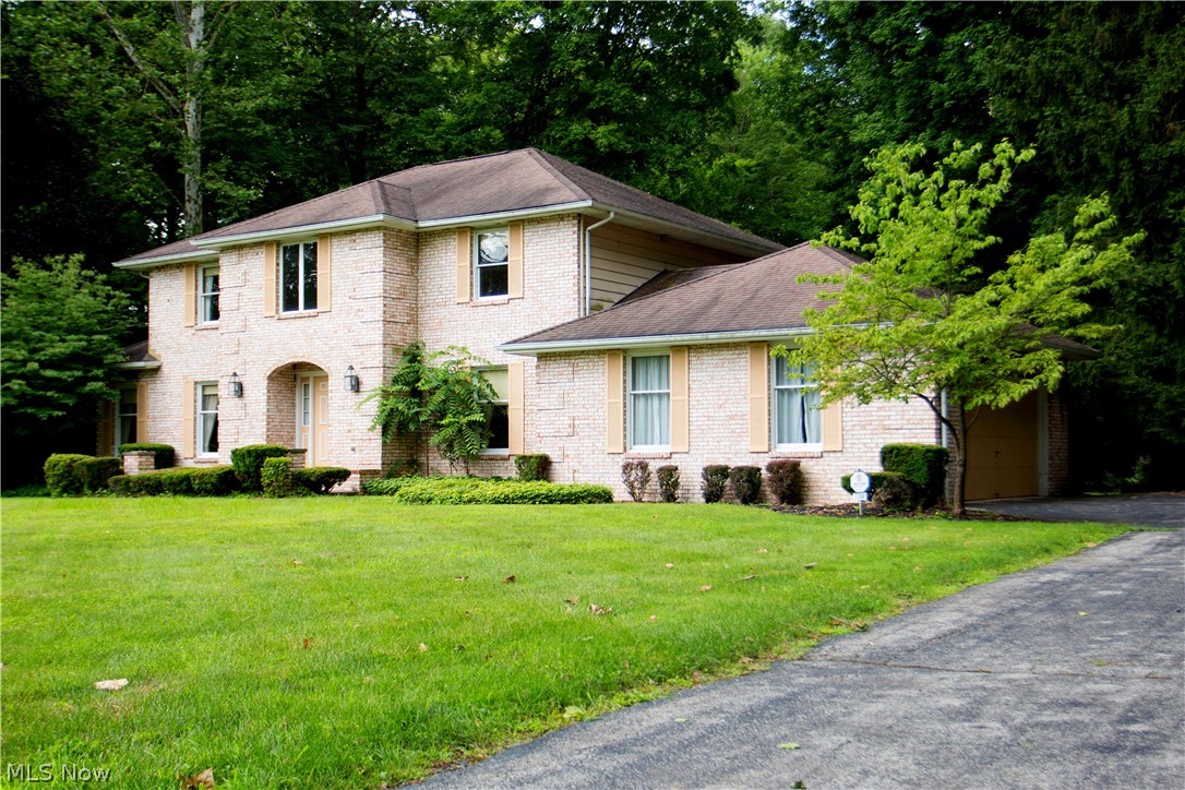 Where It's At! Location is one of the finest features of this spacious 4 bed/2.5 bath Colonial with large All Seasons Room with vaulted ceiling and a full view of serene rolling creek with wooded setting. Large Foyer entry, spacious living room, formal dining room and first floor laundry room. Full size family room with wet bar and corner fireplace. Eat in Kitchen features loads of cabinetry with access to the rear deck overlooking the wooded back yard and a beautiful outdoor setting, all within walking distance to Yellow Creek Park! 360 views at https://goo.gl/VXdvZa
