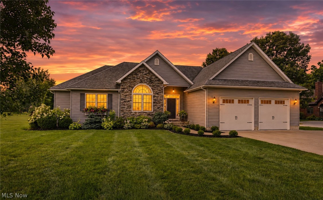 Sophisticated style, effortless one floor living, and an incredible amount of finished space make this custom ranch a standout! Nestled in one of Salem's most desirable neighborhoods, this beautifully maintained 4 bedroom, 3 bathroom home offers over 3,480 square feet of finished living space designed for both everyday comfort and entertaining. The heart of the home is the stunning open concept kitchen featuring rich custom cabinetry, granite countertops, tile backsplash, stainless steel appliances, generous island seating, and warm copper accents. The kitchen flows seamlessly into the vaulted great room with a cozy fireplace and an abundance of natural light, while the breathtaking sunroom with its dramatic wall of windows provides the perfect place to relax and enjoy views of the backyard year round. The spacious primary suite is accompanied by three additional bedrooms, three beautifully updated bathrooms, a first floor laundry room, pantry, and exceptional closet space. A dedicated office offers the flexibility to work from home or create a hobby room or guest space. Downstairs, the finished lower level adds an additional 1,179 square feet of living space complete with a huge recreation area, second kitchen, dining space, and endless possibilities for game nights, movie marathons, entertaining, or multi generational living. Step outside to enjoy the rebuilt Trex deck and paver patio, surrounded by beautifully landscaped grounds that create the perfect setting for summer cookouts or peaceful evenings outdoors.  Located in the Salem City School District with convenient access to State Routes 62, 45, and 165, this exceptional home combines luxury, functionality, and an unbeatable location. Homes like this don't come along often!