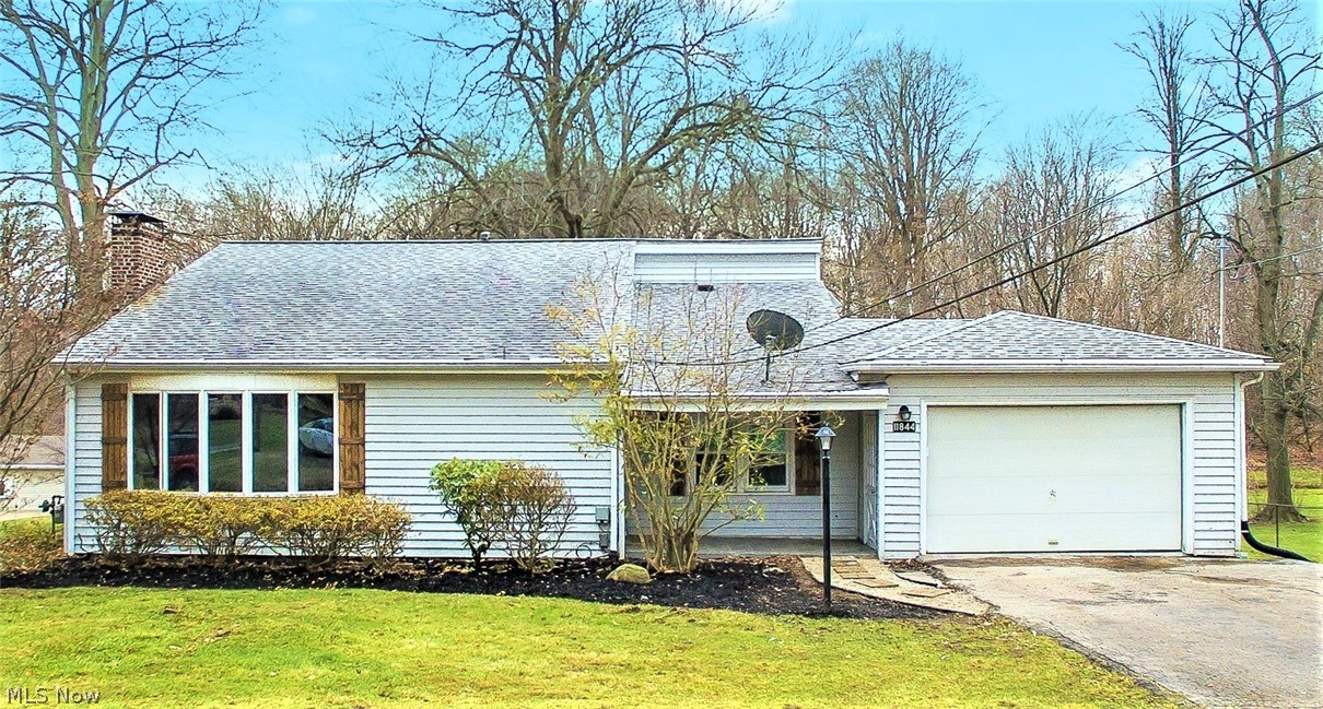 * 3,000 Sq. Ft. Beauty In A Serene Setting Offers 3-4 Bdrms, 3 FULL Bthrms, A FINISHED Walk Out Lower Level, Attached Garage, Double Tier DECK, Enclosed Back Porch, Tiled Front Covered Porch +PLUS+ 1.5 ACRES Of Land!! *Long Paved Driveway *2 Attached Sheds On The Back Of Home W/Concrete Floor For EXTRA Storage! *Residential Neighborhood W/Woods Behind *MODERN REMODELED White Trim, Neutral Grays Throughout! *LUXURY Plank Flooring & Soft Plush Shaw Carpet! *15 Finished Rms *No Shortage Of Entertaining Space W/FOUR Living/Family/Recreation Rms! *LOFT Overlooking A 2 Story Great Rm W/Fireplace & Bay Window! *Updates Include: New Kitchen W/White Arcadia Shaker Style CABINETS, Butcher Block Countertops, Stainless Appliances, Fully SHIPLAPPED Walls, Commercial Style Faucet, Above Sink Pendant Light, Triple Jar Light & Oversized Overmount Stainless Sink W/Rack  *Dining Rm Triple Pendant Glass Jar Chandelier W/2 Brick & Wood Pillars OPEN To Kitchen And Sunken Family Rm! *1st Flr Full Bathrm Adj