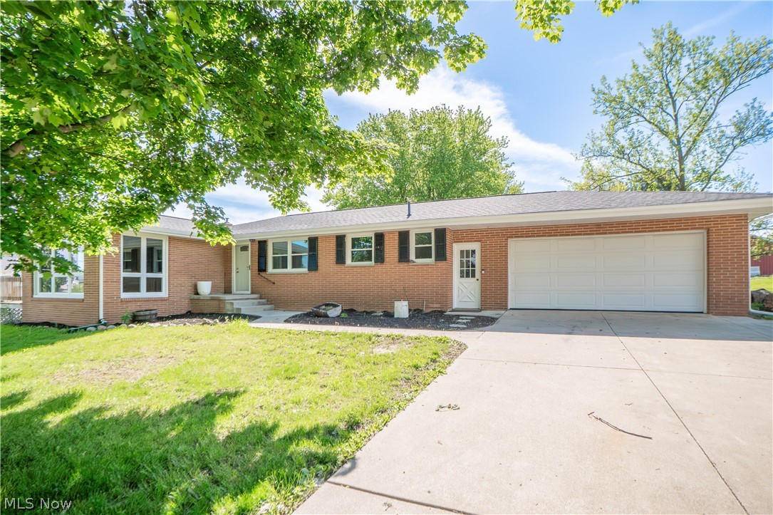Fantastic brick ranch on a beautiful .67-acre corner lot in a great Louisville neighborhood with optional lake access availablity! Inside, a spacious living room with hardwood flooring opens into a versatile sun room featuring faux timber beam details—perfect for an office, playroom, music room, or additional lounge space. The updated eat-in kitchen offers stylish finishes including tile backsplash, newer appliances, butcher block accents, farmhouse sink, updated cabinetry, lazy Susan storage, and a comfortable dinette area. All three bedrooms are located on the main level and feature hardwood floors, including a primary bedroom with ceiling fan and walk-in closet. The full bath has been completely updated, and a convenient half bath sits just off the kitchen. Downstairs, the full basement expands the living space with a partially finished rec room, bar area, decorative fireplace, freshly painted floor, cedar closet, water softener, sump pump, a whole house generator and new water filtration system. Enjoy outdoor living from the enclosed back Florida room, deck with new banister, and generous yard, plus an attached 2-car garage with opener. A wonderful blend of updates, space, and location!