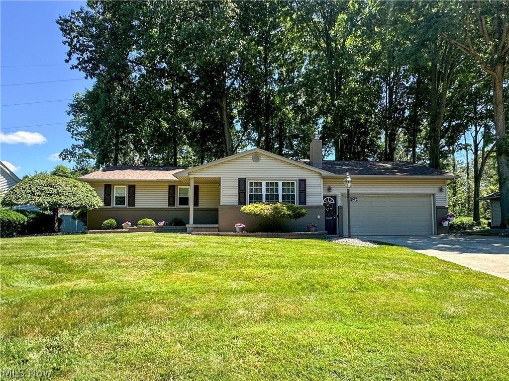This impeccably maintained and thoughtfully updated ranch home is located in a desirable neighborhood on a spacious half-acre lot. The expansive backyard is a true retreat, featuring beautiful landscaping, mature trees, and a shaded patio perfect for relaxing or barbecuing. Inside, you'll find a welcoming living room with a fireplace and a standout kitchen offering an abundance of counter space, cabinetry, and included appliances. Designed as the heart of the home, the kitchen provides plenty of room for cooking, gathering and entertaining, with an adjacent dining room featuring a sliding door that opens to the patio. The primary bedroom includes two closets and a private half bath that shares a beautifully updated walk-in shower with the main bath. Two additional guest bedrooms, each with ample closet space, complete the main level. The finished basement adds exceptional versatility with a nice rec room, bonus room, full bath with walk-in shower, laundry room, and a large storage area. A two-car attached garage provides added convenience. Move-in ready and lovingly cared for, this home showcases years of thoughtful maintenance and updates, offering comfortable living both inside and out. Schedule a tour today!