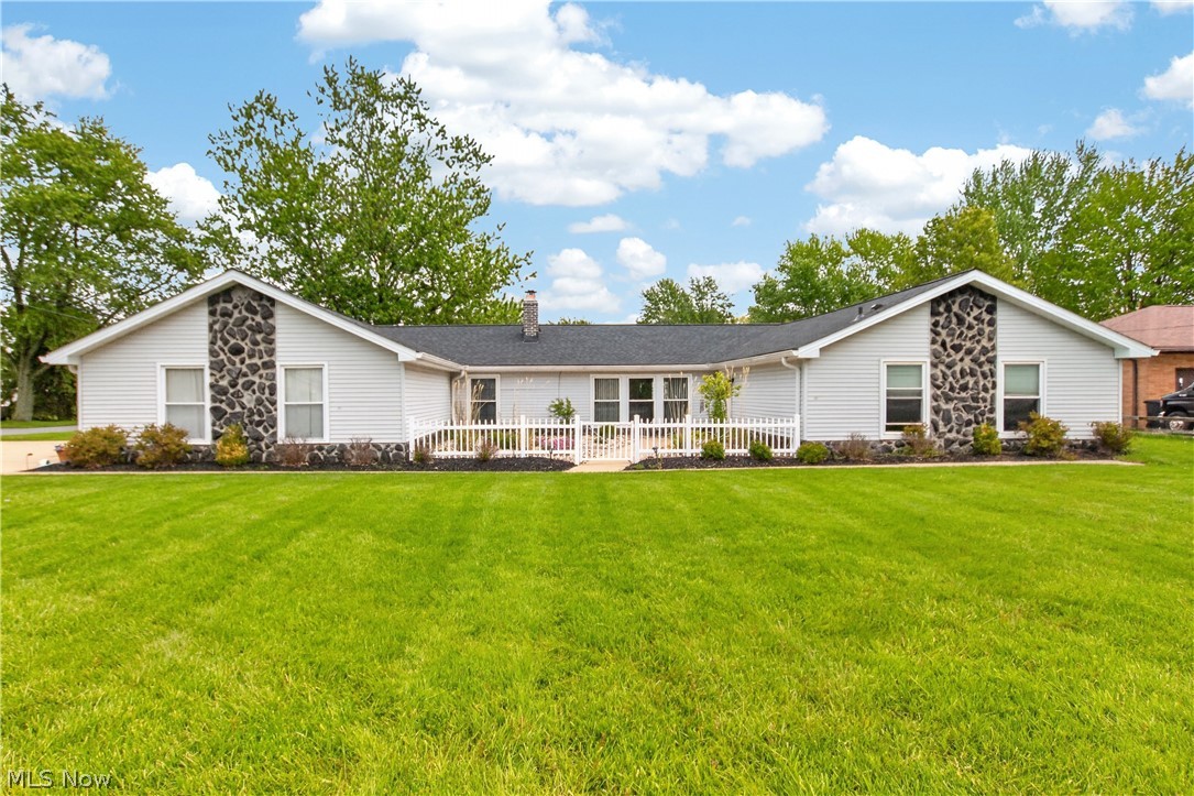 Sprawling ranch living in North Royalton! This well-maintained home offers the space, flexibility, and outdoor features today’s buyers are looking for. The refreshed kitchen features Corian countertops, newer appliances, and views of the beautifully fenced backyard—complete with an impressive 500-square-foot enclosed vegetable garden with berries and herbs, plus your own private putting green. Inside, the cozy living room is anchored by a wood-burning fireplace, while the versatile floor plan includes four bedrooms plus a potential fifth bedroom or home office. The spacious primary suite offers a walk-in closet and updated bath, and the oversized laundry room adds everyday convenience. Major exterior updates, including the roof, soffits, and gutters, were all completed in 2024, and replacement windows provide added efficiency and comfort. Enjoy relaxing in the charming front courtyard, and move in with confidence knowing all appliances stay, and a home warranty is included for added peace of mind.
