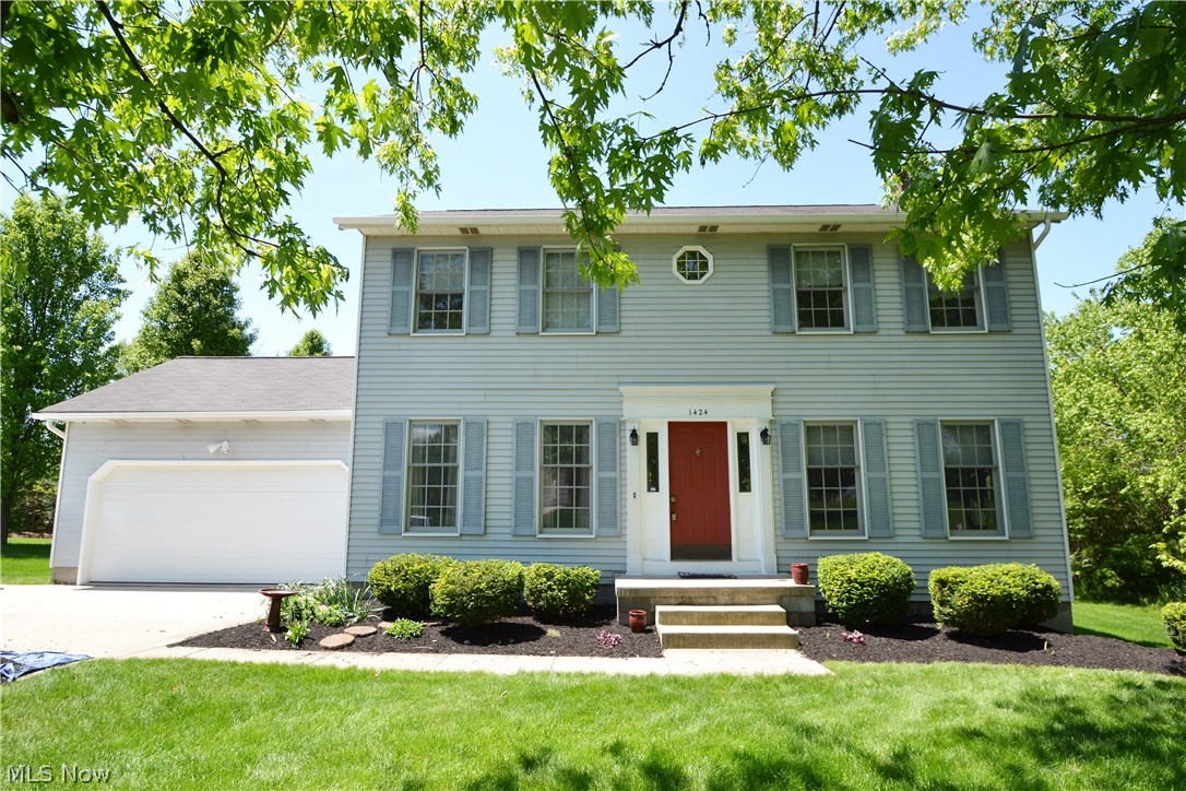 Great location for this 4 bedroom 2.1 bath colonial in Hudson. Located in Carriage Hill Estates the rear yard with it's large covered and screened porch leads to the open deck with a private treed yard. Off the front foyer you will see the large family room with wood burning fireplace and on the other side of this center hall colonial there is a formal dining room currently being used as an office. The large spacious kitchen has a center island great for eating snacks or just watching the cook do their job.This kitchen has plenty of space for a kitchen table and chairs. No wallpaper here as it has all been removed and walls freshly painted in April 2016. The microwave is about 2 years & the dishwasher is only about 5 years young. The stove and refrigerator are also newer.  The second floor features a master bedroom with private bath as well as 3 additional bedrooms, one used as an office, and a second full bath with skylight. On the lower level there is a great family or media room and