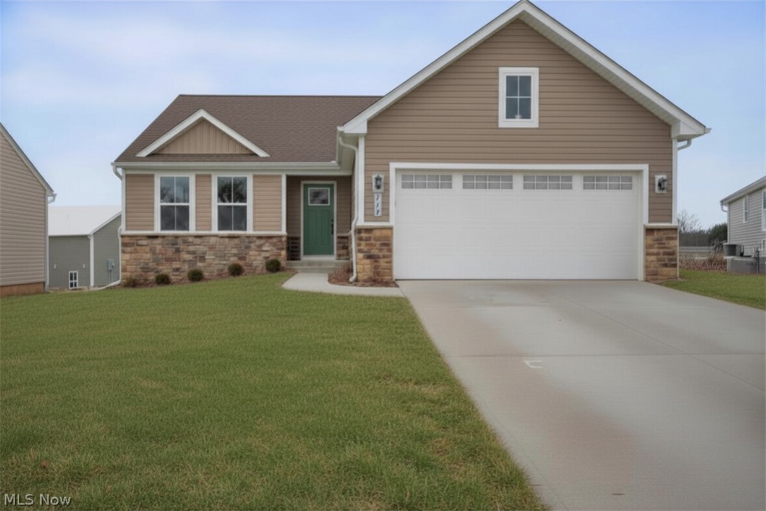 Available NOW with no construction wait! This extra-spacious, move-in ready RANCH home features a covered deck, full basement with egress windows, and is nicely appointed throughout with around $40,000 in selected upgrades. It is located on a premium cul-de-sac property with no neighbors in the back, and sits further back with an extra-long driveway and more privacy in the Hidden Lakes Development - Lakemore Village. This community provides the opportunity to simplify your lifestyle with a low monthly fee that includes mowing, fertilization, yearly mulch, and snow plowing. The open-concept interior, Grand Cayman plan, includes upgraded cabinets, granite countertops, stainless steel appliances, and LVP flooring in the common areas. A first-floor laundry room includes a washer and dryer. The primary suite has a large walk-in closet and an en-suite bath with a walk-in shower and double sinks. The full basement with egress windows provides abundant natural light, generous storage, rough-in plumbing for a future full bathroom, and excellent potential for additional living space, a home office, guest suite, or recreation area. The owner has painted/finished garage walls, and added washer/dryer since moving in. Located near Springfield Lake with scenic trails, fishing, and more. Conveniently located near I-77, I-76, shopping, dining, and many other local attractions.