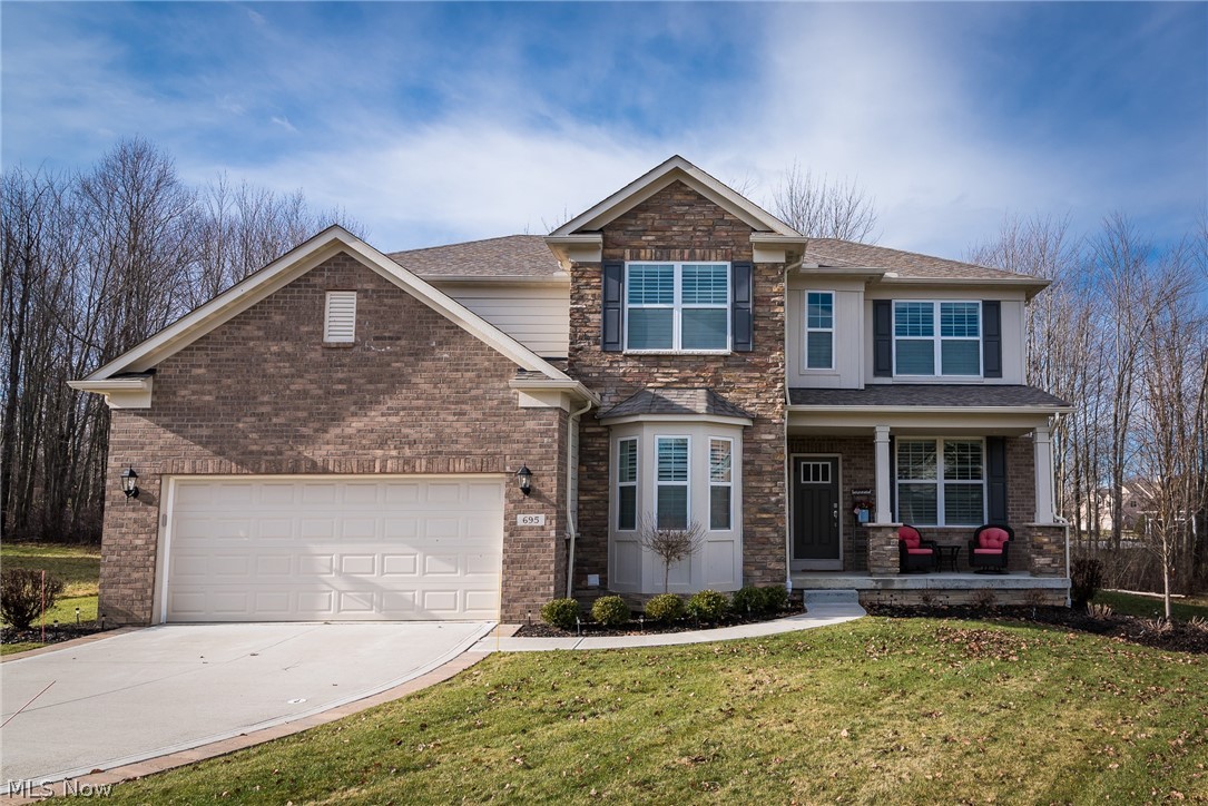 Beautiful freestanding condo in Clubside Manor in Barrington offers maintenance free living. Built by Pulte Homes, there are many upgrades throughout. The welcoming front porch is perfect to sit and enjoy a quiet cup of coffee. As you enter the house, there is an office or living room with French doors and formal dining room. Wood laminate flooring is in the foyer, dining room, great room & kitchen. The great room and kitchen offer an open floor plan with a gas fireplace and a wall of windows in the great room. The kitchen features an abundance of white cabinets, a center island with quartz countertops and breakfast bar, stainless appliances, and an eating area with a door to the private patio. Two special features are a coffee bar between the kitchen and dining room and a family work center for computer time. Laundry is on the first floor with cubbies in the back hall entrance from the garage. The master bedroom is on the first floor with double vanities, a separate shower and tub and