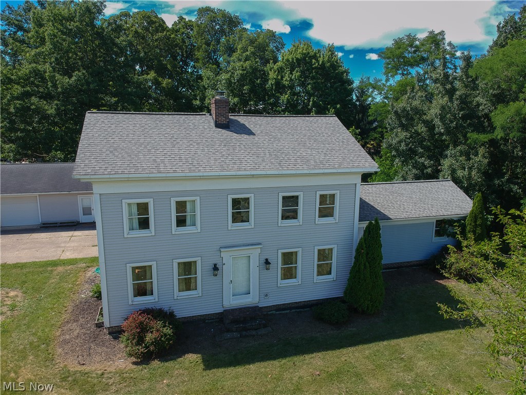 Welcome home to this one-of-a-kind 1800s Colonial where timeless character meets modern peace of mind! If you've always dreamed of owning a historic home but worried about the maintenance, this is the perfect blend of classic charm and updated convenience. Featuring 5 bedrooms, 3 full bathrooms, and situated on nearly 4 private acres, this property offers the space and flexibility today's buyers are looking for.

From the moment you step inside, you'll appreciate the beautiful hardwood floors, original character, and spacious rooms throughout. The first-floor owner's suite includes a private en suite bath, creating the perfect retreat. Upstairs you'll find three additional bedrooms and a full bathroom, while the detached in-law suite with its own full bath provides endless possibilities for guests, multi-generational living, a home office, or private studio.

Unlike many century homes, this property has already been updated with the improvements buyers want most, including new plumbing, updated electrical wiring, a newer furnace, central air conditioning, a new hot water tank, and a modern basement—giving you the beauty and craftsmanship of an 1800s home without many of the common century-home concerns. A brand-new septic system is included and will be installed, offering even more confidence for the next owner.

Outside, relax on your private deck overlooking the peaceful acreage. The property also features a 3-car garage and two outbuildings, including a horse barn ready for your finishing touches, making it ideal for hobby farmers, horse enthusiasts, storage, or workshop space.

Whether you're looking for a historic Colonial, hobby farm, horse property, multi-generational home, or simply room to spread out, this exceptional property delivers the perfect combination of history, modern updates, privacy, and country living.  Easy Commute to Cleveland or Akron, close to I 71 and 76.
