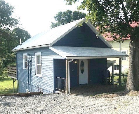 Good things come in small packages and you will be delighted with the inside of this small "package." This cozy home has been completely renovated throughout. Nothing left undone! You'll love the hickory kitchen cabinets with granite counter tops and stainless appliances. The breakfast bar separates the kitchen and living room. A sliding barn door, custom made, closes off the bathroom in style. The glass-front door in the kitchen leads to the spacious deck overlooking the backyard. The lower level, in addition to the laundry and side door exit, has the 2 bedrooms. From the time you step on the welcoming front porch you will feel at home. The move-in ready darling of a home won't last long so call today!