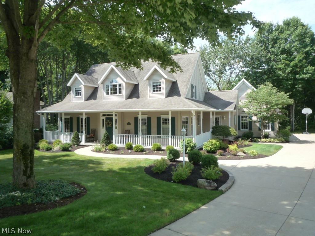 Quality Built One Owner High Hampton Home!  Custom Built one and a half story features a Spacious 1st Floor Master Suite.  Striking Vaulted Ceilings and beautiful Windows let in lots of natural light.  Enjoy time on the Private Deck overlooking the woods behind. Kitchen features an Island Breakfast Bar with a Jenn-Air Cooktop as well as a Bayed Eating Area.  The beautiful Hardwood Floors stretch from the Open Foyer through the Formal Dining Room and Kitchen.   The 1st Floor Office features French Doors and Built in Cabinets.  The large Master Bath includes a Claw Tub, Shower, Walk-in Closet w/ Built in Shelving, Double Sinks and access to the Hot Tub on the Back Deck.  The upstairs includes a dramatic Lofted Area and two separate Bedrooms, each with their own Full Bath   Both Bedrooms also have Double Closets, a Dormered Window Area and a large Storage Closet. Access the 3 Car Garage off of the oversized 1st Floor Laundry Room.  The front and side of the house feature a Wrap Around Por
