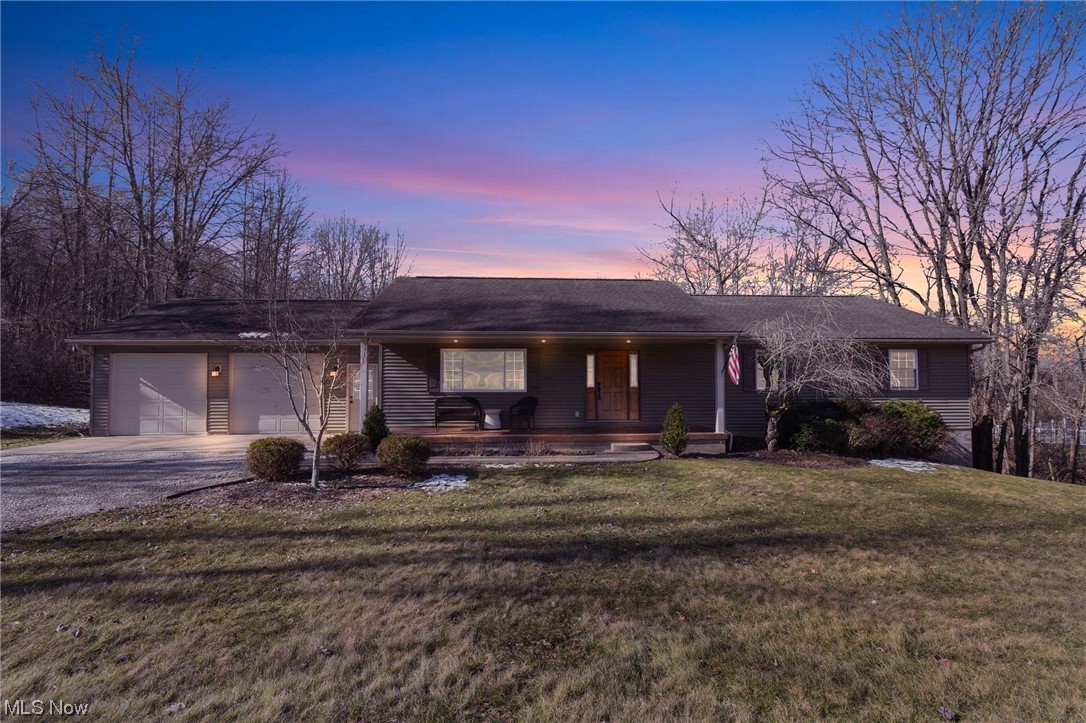 Welcome to your beautiful new home in the country, enjoy the peace and tranquility, still just minutes away from I70 access and convenient shopping. You can enjoy over 2 1/2 acres with the purchase of a 1.29 acre wooded parcel next door. This 1 owner home has been well-maintained and has room for a growing family or someone looking for a ranch with room to entertain.  Updated master bath is like a spa. Large deck overlooks your very private yard, a large family room on lower level walkouts to the backyard and includes a fireplace.  Huge attached 2 car garage, but plenty of room on the additional lot if you want to build a pole barn.  Storage galore in the unfinished 1/2 of the basement.  Basement finished with 2 extra blocks for height.  Move in ready today.