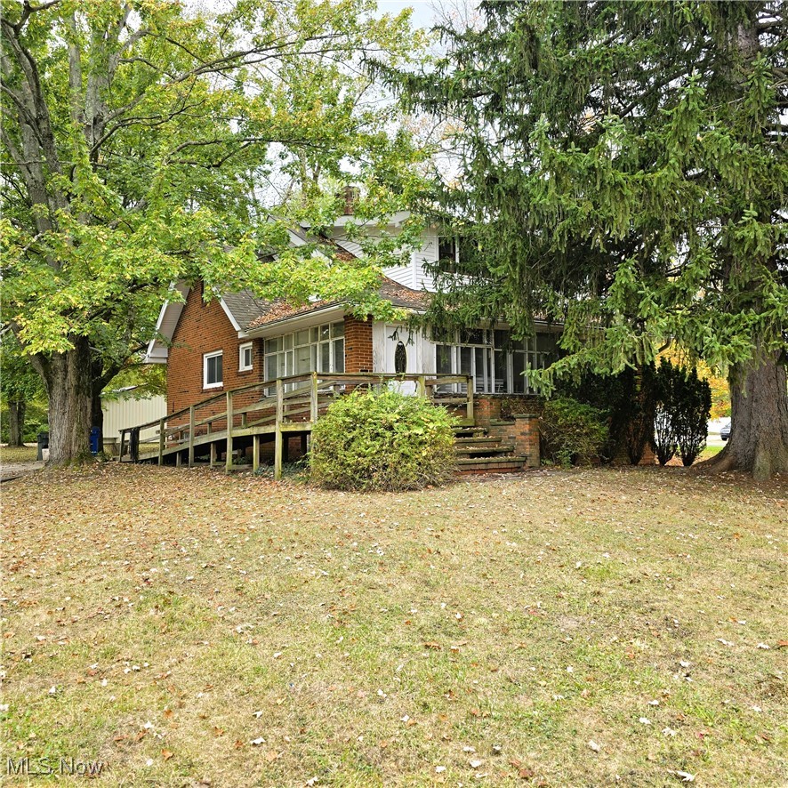 Be first or be sorry! Immediate possession! Four bedroom Cape Cod on over 6 acres! Eat in kitchen. First floor laundry room. Main bath updated approximately 5 years ago. Formal dining room with built-in cabinets and window seat. Big living room with double french doors leading to a home office and 3 season sun room. Three bedrooms with big closets on the second floor. Big glass block windows in the basement. Updated electrical panel. Updated furnace. Absolutely beautiful yard! Huge 40x30 out building built in the early 2000's. Must see! Country living in the city but near all city conveniences! Hardwood floors under some carpeting. Includes one year home warranty!