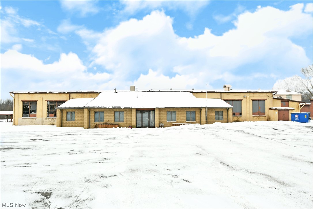 Buildings on the property have the following dimensions: 228X176, 82X50, 40X28, 73X111.  Are you looking for a totally unique business opportunity with tons of available space and land to develop? Look no further as this must-see Liberty Township offering holds all the potential and more! Uniquely located and able to be paired with additional nearby acreage; this former steel stamping and production facility showcases a massive footprint that includes all the current machinery and processing equipment alike. Industrial grade metal brakes, shears, lathes and more are all found on-site of this surprisingly viable package. Multiple overhead crane assemblies join equally substantial truck access points for both shipment and deliveries of raw goods and finished products alike. Notable additions are a large central paint booth with an automated dipping basin, large commercial grade air compressor and vacuum pump assemblies, a small machine shop and rear offices that oversee the multi-tier layout of the main building. A front end with additional office space, bathrooms and more keeps daily operation. Two other oversized outbuildings allow for easy storage or available space for subletting as needed. An included home with a wrapping, mobility friendly patio accompanies the property along with an offset swimming pool to capture a sustainable live-in-business venture.