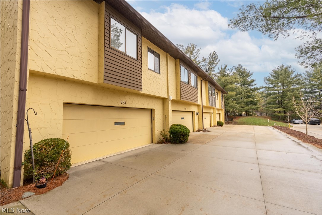 Welcome home to this beautifully maintained Condo in the highly sought-after Hampton Woods community! Offering 2 spacious bedrooms, 2 full bathrooms, and a 2-car garage with a brand-new floor (2025), this unit combines comfort, style, and convenience. Step inside to a bright and airy living room featuring vaulted ceilings and a stunning fireplace, perfect for relaxing or entertaining. The open layout flows seamlessly into the dining area and out to your private balcony, where you can enjoy peaceful views of mature trees or the community pool. The updated eat-in kitchen is a standout, complete with granite countertops, gorgeous cabinetry, and a brand-new stainless steel refrigerator (2025). Down the hall, you'll find a freshly painted full bathroom and a generously sized bedroom with an oversized closet. The spacious primary suite offers a large walk-in/pass-through closet and a freshly painted en-suite bathroom. This home is packed with storage, including abundant closet space and a large in-suite laundry room. Major mechanical updates include furnace and A/C (2022) and hot water tank (2023), giving you peace of mind for years to come. Enjoy resort-style living with access to a beautiful in-ground pool and tennis courts, all within the community. Conveniently located near shopping, dining, and stunning outdoor destinations like Cuyahoga Valley National Park, Sand Run Metro
Park and Seiberling Nature Realm, with easy access to major highways. Don't miss your chance to own this move-in-ready gem. Schedule your showing today before it's gone! Home warranty included for extra peace of mind.