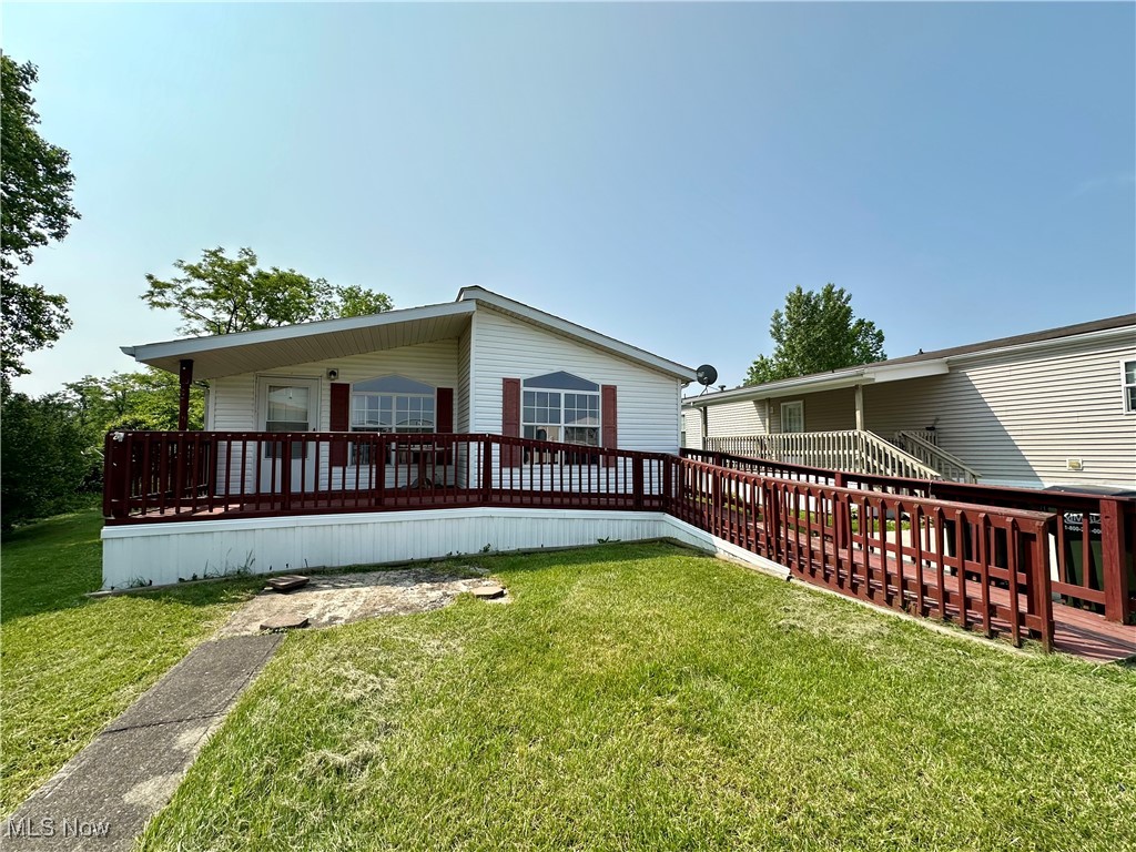Affordable, updated and all one-level! 87 S Byron Drive is a well-maintained, manufactured home in Colonial Heights that boasts many attractive features. This home includes a newer roof (2021), and newer flooring throughout the kitchen, bathrooms, master bedroom, hallway and laundry area. Both full-bathrooms contain updated bathtubs and sinks. Kitchen has been refreshed with newer paint and backsplash. All appliances stay. Please note that all prospective buyers must be approved by park management before purchasing. The monthly lot rent is $419, which includes trash removal. Colonial Heights has a welcoming pet policy, allowing up to two small pets (dogs up to 35 pounds). Please contact the community manager for details regarding breed and age restrictions. Residents also enjoy access to a variety of amenities, including a new gazebo, a community center, and a fitness center. There is nothing to be done at 87 S Byron except move-in! Schedule a private showing while you can!