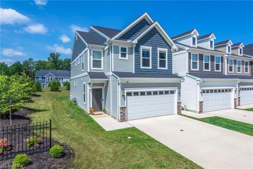 Skip the builder wait and move right into this stunning 2022 end-unit townhome offering over 2,000 square feet of beautifully designed living space. With extra windows exclusive to an end unit, this home is filled with natural light and showcases today's most sought-after finishes throughout.  The open-concept main level is anchored by a dramatic floor-to-ceiling stone fireplace and flows seamlessly into a gorgeous chef's kitchen featuring quartz countertops, an oversized center island with seating, gray shaker cabinetry with designer hardware, stainless steel appliances, a gas range, subway tile backsplash, and a spacious walk-in pantry.  
Luxury vinyl plank flooring, recessed lighting, and neutral finishes create a warm, modern feel that complements any style.  
Upstairs, the spacious primary suite offers a tray ceiling, large walk-in closet, and an adjoining flex room ideal for a home office, fitness space, nursery, reading lounge, or dressing area. Two additional bedrooms, a full bath, and convenient second-floor laundry complete the upper level.  Enjoy a private patio, attached two-car garage, low-maintenance living, and an exceptional Westlake location just minutes from Crocker Park, shopping, restaurants, parks, and easy highway access.  Modern construction. End-unit privacy. Move-in ready.
