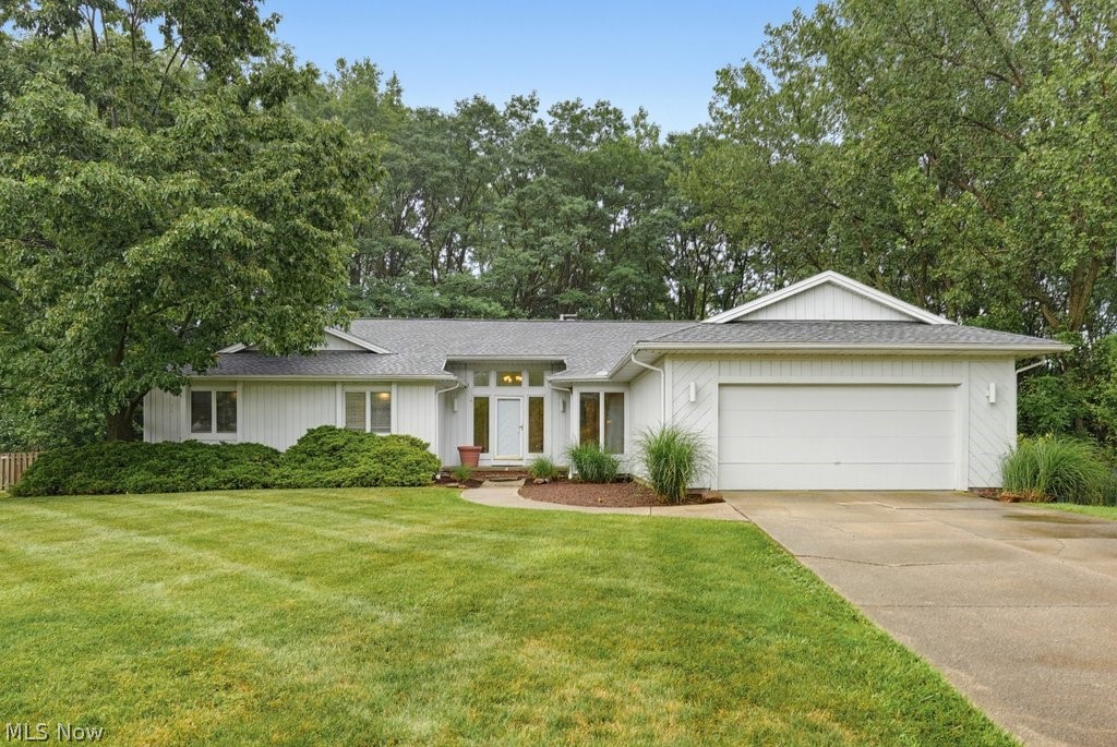 Located in the highly sought-after Orange School District, this beautifully updated 3-bedroom, 2-bath ranch offers the ease of single-floor living with stylish modern updates, all tucked away on a cul-de-sac. Step inside to a warm and inviting living room featuring a stunning stone fireplace that creates the perfect focal point for cozy evenings and effortless entertaining. The remodeled kitchen with oversized island showcases contemporary finishes, abundant cabinetry, and a seamless flow into the dining and living areas, making everyday living and hosting a breeze. The spacious primary suite offers a large walk-in closet, while both updated bathrooms feature fresh, modern finishes designed for comfort and convenience. A bright, sun-filled three season room provides the perfect place to relax and opens onto a wood deck overlooking the fully fenced backyard—ideal for pets, play, gardening, or private outdoor gatherings. The expansive 2000sf+ finished lower level significantly expands the home's living space, offering endless possibilities for a recreation room, home office, fitness area, media room, or playrooms. Combining thoughtful updates, flexible living spaces, and a desirable location in the Orange School District, this move-in-ready ranch is one you won't want to miss.