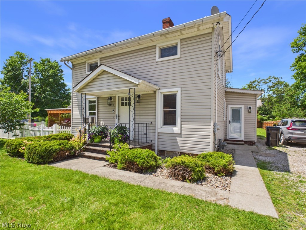 Welcome home to this charming, move-in ready two-story Colonial that blends timeless character with modern updates. Beautifully maintained throughout, this home features updated flooring, fresh paint, new lighting fixtures, kitchen updates, new front and side entry doors, and numerous improvements that create a bright, airy, move-in ready space. The spacious kitchen features a center island with additional prep space and storage, while the adjacent laundry room adds convenience. The large dining room is filled with natural light and provides plenty of space for gatherings. Sliding glass doors lead directly to the spacious covered Trex deck, creating a seamless indoor-outdoor living experience perfect for relaxing or entertaining. The flexible floor plan includes a first-floor bedroom and a generously sized full bathroom on the main level, offering convenience for guests, a home office, or one-floor living options. Upstairs, you'll find two additional bedrooms with ample space and natural light. A breezeway/mudroom provides the perfect drop zone for coats, shoes, and everyday essentials. Outdoor living is a standout feature with a large fenced backyard, covered Trex deck, patio with fire pit, and storage shed. The basement offers excellent storage space and includes a workbench, making it ideal for hobbies and projects. Conveniently located with easy freeway access, commuting and travel are simple while still enjoying the comfort of a residential setting. A home warranty is included for added peace of mind. Don't miss the opportunity to own this beautifully updated home that offers charm, functionality, and fantastic indoor and outdoor living​​‌​​​​‌​‌​​​‌‌​​​‌‌‌​​‌​​‌‌​​​​ spaces.